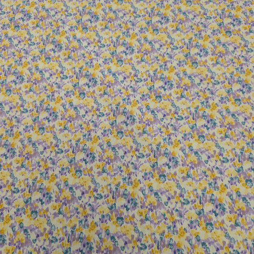 Japanese cotton fabric with a floral pattern with small flowers in purple, yellow and blue, for sale at Minerva's Bower