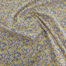 Load image into Gallery viewer, Drape of Japanese cotton fabric with a floral pattern with small flowers in purple, yellow and blue, for sale at Minerva&#39;s Bower