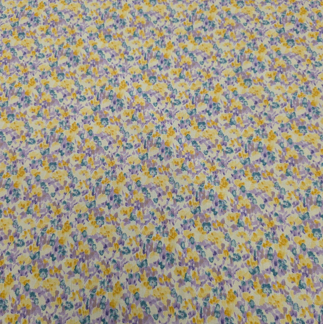Japanese cotton fabric with a floral pattern with small flowers in purple, yellow and blue, for sale at Minerva's Bower