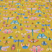 Load image into Gallery viewer, Flat lay of Thread and Ink 100% cotton, Flutter By, mustard cloth with all over butterfly dragonfly and insect print - available at Minerva's Bower