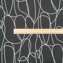 Load image into Gallery viewer, Klee is a stunning pure cotton with continuous, large scale, line drawings. White lines on a black background, available at Minerva&#39;s Bower. Image includes a ruler for scale