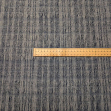Load image into Gallery viewer, Flat lay of Yarn dyed 77% linen 23% cotton blend seersucker in Indigo, ruler included for scale - for sale at Minerva's Bower