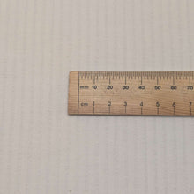 Load image into Gallery viewer, Close up flat lay of 100% cotton dobby Ivory Crossline, ruler included for scale - for sale at Minerva's Bower
