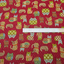 Load image into Gallery viewer, Pattern of colourful cats on a red cotton dobby background. Made in Japan. Available at Minerva's Bower. Ruler included for scale
