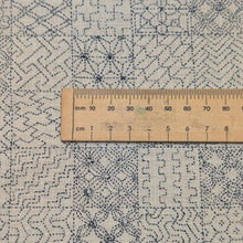 Load image into Gallery viewer, Patterned fabric with geometric sashiko design on a cream cotton background. Made in Japan. Available at Minerva's Bower. Ruler included for scale
