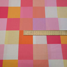 Load image into Gallery viewer, Checkered cotton fabric with pink, orange, and yellow squares. Made in Japan. Available at Minerva's Bower. Ruler included for scale