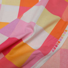 Load image into Gallery viewer, Checkered cotton fabric with pink, orange, and yellow squares. Made in Japan. Available at Minerva's Bower. Fabric draped to show how it handles