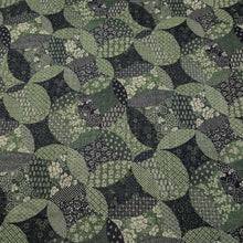 Load image into Gallery viewer, Patterned cotton fabric with green and black circles and shapes. Made in Japan. Available at Minerva's Bower