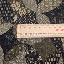Load image into Gallery viewer, Patterned cotton fabric with circular shapes in shades of grey, brown, and blue. Made in Japan. Available at Minerva's Bower. Ruler included for scale