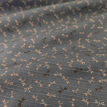 Load image into Gallery viewer, Flat lay of dragonfly print Japanese Double Sided Shantung, Tombo. Available at Minerva&#39;s Bower. Fabric draped to show how it handles