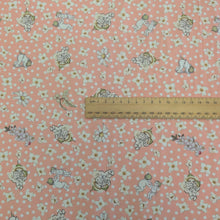 Load image into Gallery viewer, Flat lay of 95% bamboo and 5% elastane jersey with may gibbs gumnut baby design, ruler included for scale, for sale at Minerva's Bower