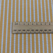 Load image into Gallery viewer, Flat lay of Joy cotton seersucker in mango colourway. Available at Minerva&#39;s Bower. Ruler included for scale