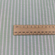 Load image into Gallery viewer, Flat lay of Joy cotton seersucker in mint colourway. Available at Minerva&#39;s Bower. Ruler included to show scale