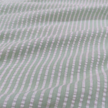 Load image into Gallery viewer, Flat lay of Joy cotton seersucker in mint colourway. Available at Minerva&#39;s Bower. Fabric draped to show scale