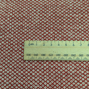 Close up of Japanese 100% cotton  fabric with traditional spot design, for sale at Minervas Bower and a ruler included for scale