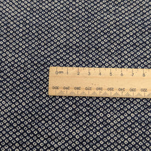Load image into Gallery viewer, Close up of Japanese 100% cotton Indigo fabric with traditional spot design, for sale at Minervas Bower and a ruler included for scale 