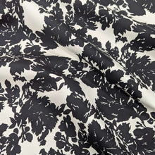 Load image into Gallery viewer, Draped Black floral pattern cotton twill fabric with a white background, for sale at Minerva&#39;s Bower