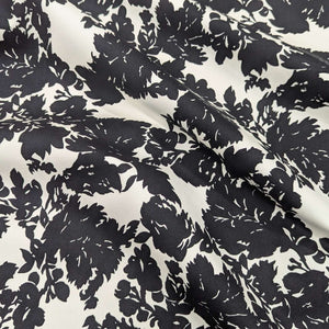 Draped Black floral pattern cotton twill fabric with a white background, for sale at Minerva's Bower