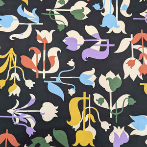 Patterned Liberty of London fabric with colorful floral design on a black background. Available at Minerva's Bower