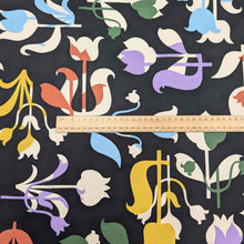 Load image into Gallery viewer, Colorful floral pattern on black Liberty of London fabric with a ruler for scale. Available at Minerva&#39;s Bower
