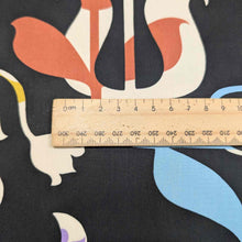 Load image into Gallery viewer, Colorful abstract Liberty of London pattern with a ruler for scale on a black background. Available at Minerva&#39;s Bower