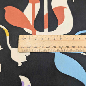 Colorful abstract Liberty of London pattern with a ruler for scale on a black background. Available at Minerva's Bower