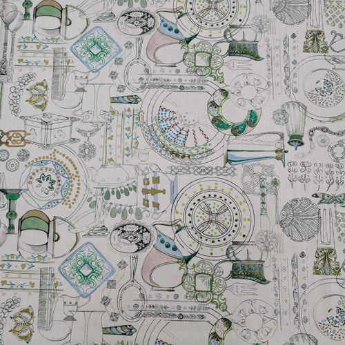 Patterned Liberty fabric with green and blue designs on a white background. Available from Minerva's Bower
