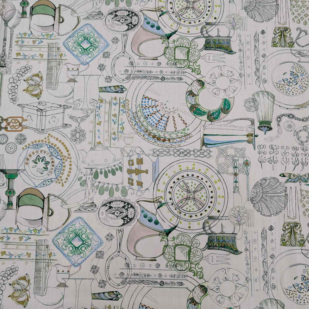 Patterned Liberty fabric with green and blue designs on a white background. Available from Minerva's Bower