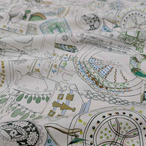 Patterned Liberty fabric with teapots and tea cups on a white background. Available at Minerva's Bower