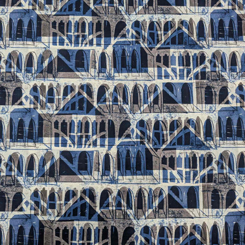 Liberty of London patterned fabric with architectural design in blue, brown, and beige. Available at Minerva's Bower