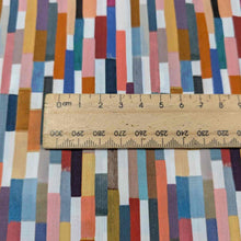 Load image into Gallery viewer, Colorful geometric patterned Liberty of London fabric with a wooden ruler for scale. Available at Minerva&#39;s Bower
