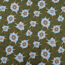 Load image into Gallery viewer, Liberty of London patterned fabric with blue and brown geometric shapes on a green background. Available at Minerva&#39;s Bower