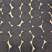 Load image into Gallery viewer, Pattern of black circles on a beige cotton/linen fabric background. Made in Japan. Available at Minerva's Bower