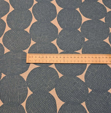 Load image into Gallery viewer, Pattern of dark grey circles on a beige cotton/linen fabric background. Made in Japan. Available at Minerva's Bower. Ruler included for scale