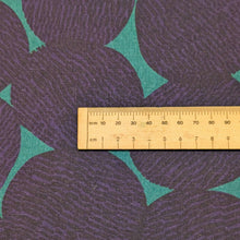 Load image into Gallery viewer, Pattern of purple circles on a teal cotton /linen fabric background. Made in Japan. Available at Minerva's Bower. Ruler included for scale