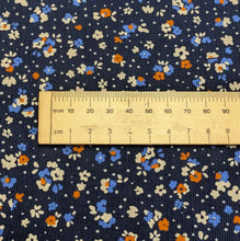 Load image into Gallery viewer, Close up flat lay of Lucille 100% Cotton Pinwale Cord in Blue by Kokka, ruler included for scale - for sale at Minerva's Bower 