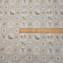 Load image into Gallery viewer, Flat lay of 100% Cotton, May Gibbs, Garden Playtime in Sage, ruler included for scale - for sale at Minerva's Bower