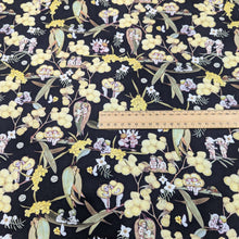 Load image into Gallery viewer, Flat lay of 100% Cotton, May Gibbs - Gumnut Gossiping in Black, for sale at Minerva&#39;s Bower, ruler included for scale