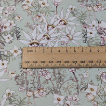 Load image into Gallery viewer, Close up of 100% Cotton, May Gibbs - Pastel Flowers Mint, for sale at Minerva&#39;s Bower, ruler included for scale