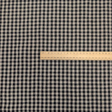 Load image into Gallery viewer, Flat lay of Melange 100% Linen, Black Oatmeal Gingham Check, for sale at MInerva's Bower, ruler included for scale