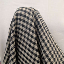 Load image into Gallery viewer, Standing drape of Melange 100% Linen, Black Oatmeal Gingham Check, for sale at MInerva's Bower
