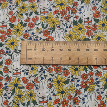 Load image into Gallery viewer, Close up flat lay of Liberty 100% Cotton Tana Lawn, Miffy Prairie Day A ruler included for scale - for sale at MInerva's Bower