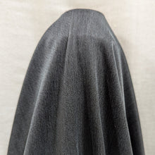 Load image into Gallery viewer, Flat lay of black silky Cupro moiwa, showing both satin and crepe side. Available at Minerva&#39;s Bower. Fabric is draped to show how it handles