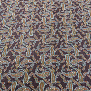 Patterned lyocell fabric with paisley design on a burgundy base, available at Minerva's Bower