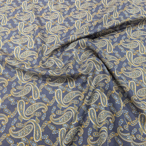 Flat drape of Patterned lyocell fabric with paisley design and a blue base, for sale at Minerva's Bower