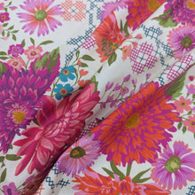 Load image into Gallery viewer, Draped 100% cotton by moda with Colourful floral pattern with pink, purple, and green flowers on a cream background