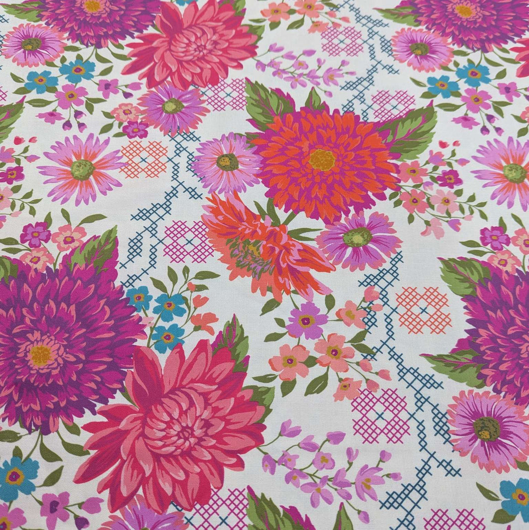 100% cotton by moda with Colourful floral pattern with pink, purple, and green flowers on a cream background