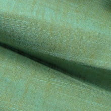 Load image into Gallery viewer, Green fabric cotton fabric texture swatch. Available at Minerva's Bower. Fabric draped to show how it handles