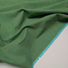 Load image into Gallery viewer, Green fabric cotton fabric texture swatch. Available at Minerva's Bower. Fabric draped to show how it handles