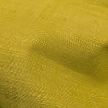 Load image into Gallery viewer, Solid green colour cotton fabricswatch with a textured pattern. Available at Minerva's Bower. Fabric draped to show how it handles
